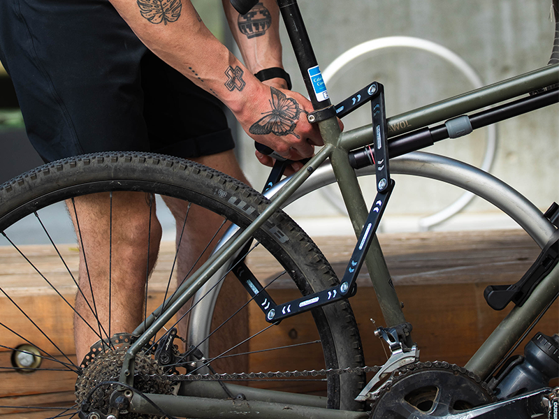 A person locking the bike properly.